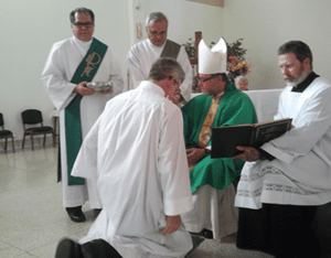 Jay Krueger receiving the Right of Acolyte